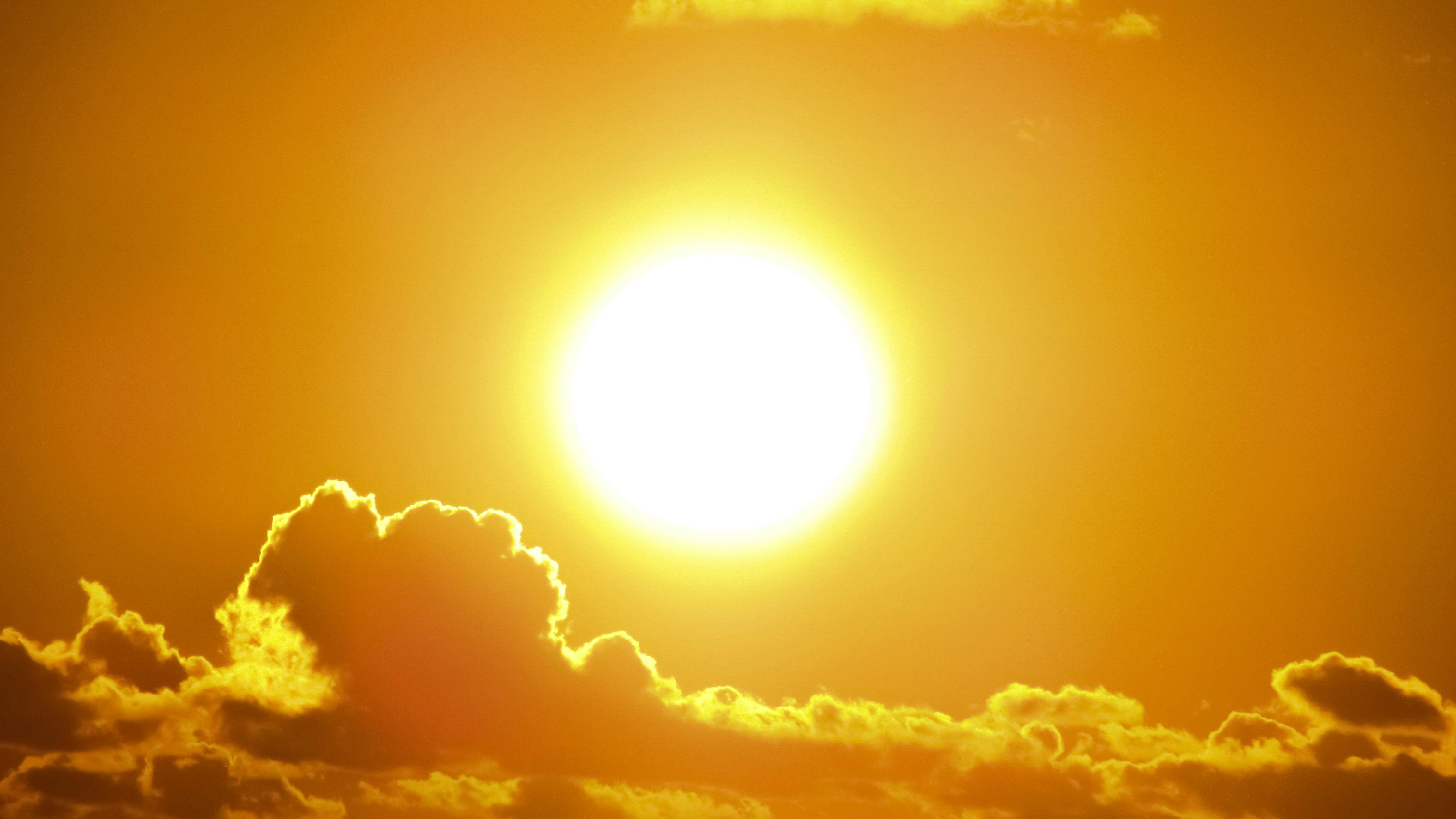 The sun shining brightly in the sky